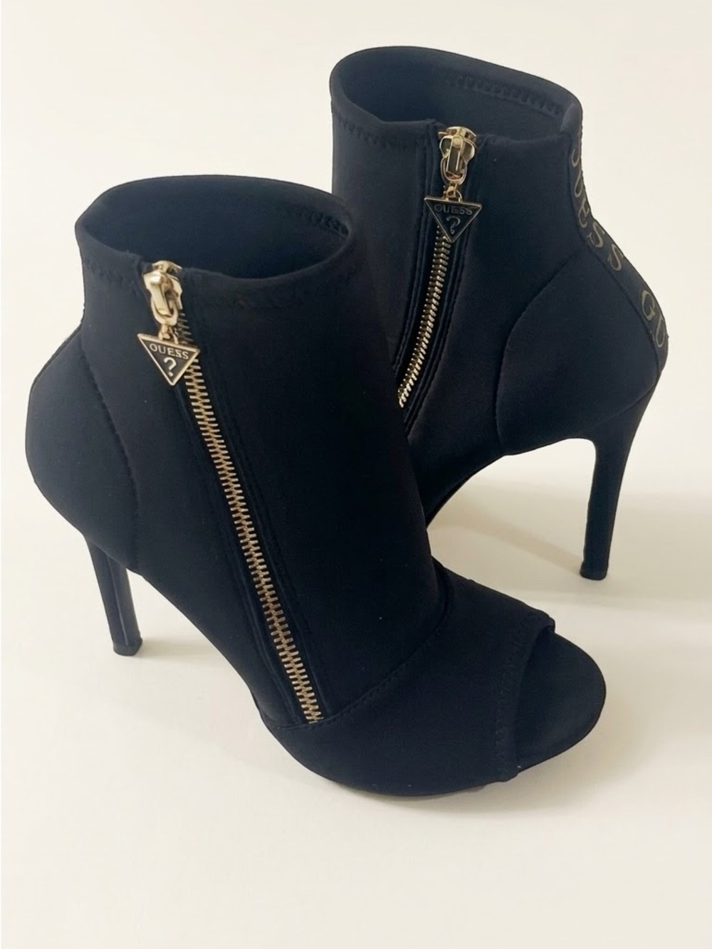 GUESS Black Peep-Toe Stiletto Ankle Boots with Gold Zippers